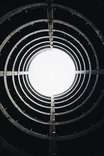 black wallpapers low angle photography of round gray concrete building interior circle